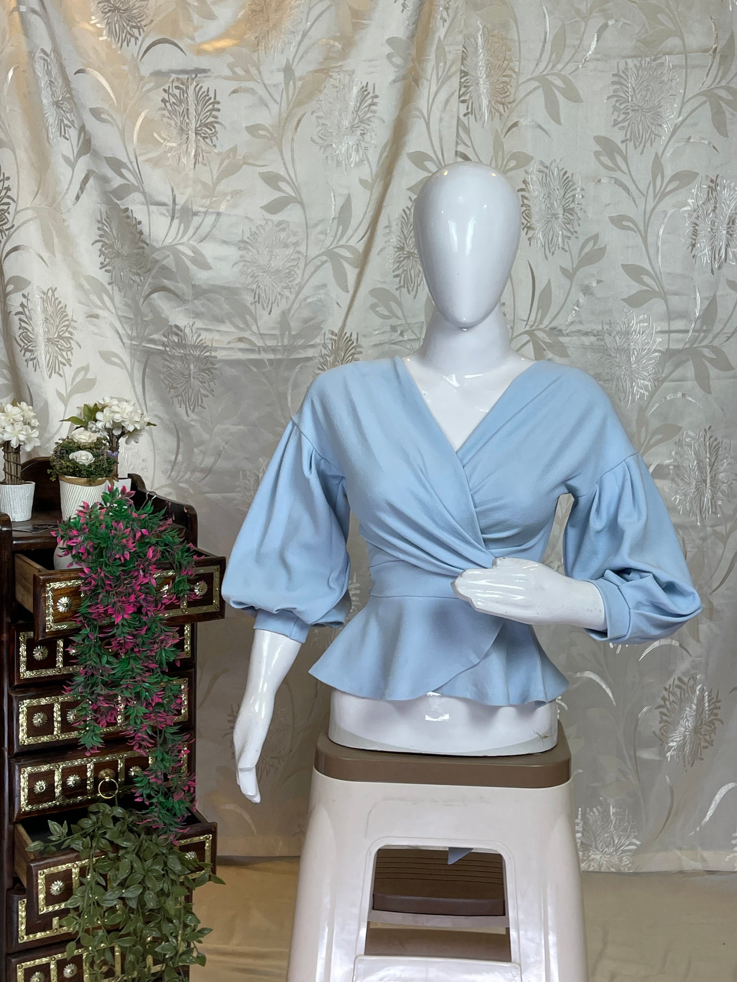 Light Blue Wrap-Style Peplum Top