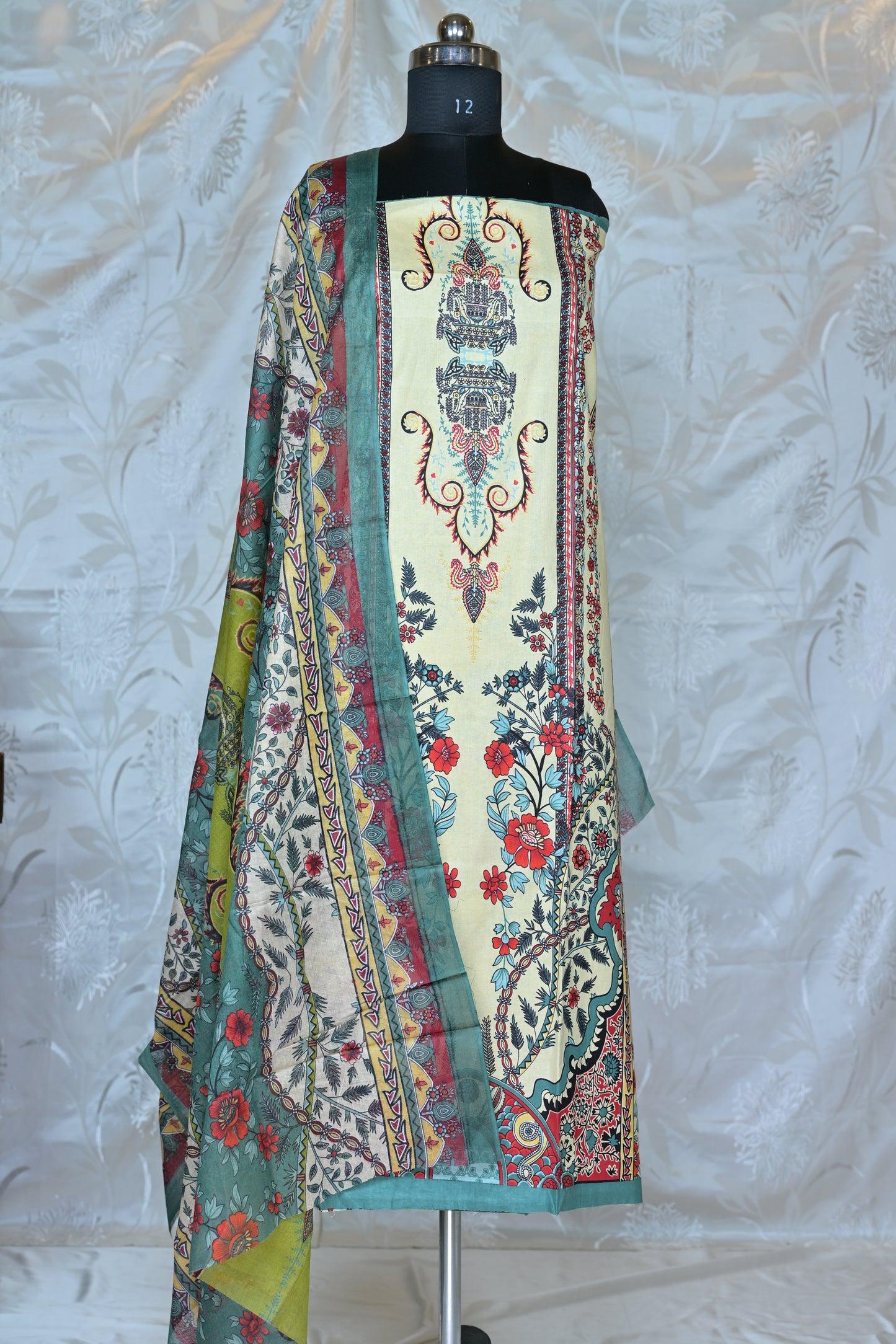 Elegant Printed Unstitched Suit Set with Traditional Motifs  Description: